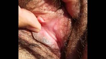 showing amazing hairy fat pussy and showing pink clit
